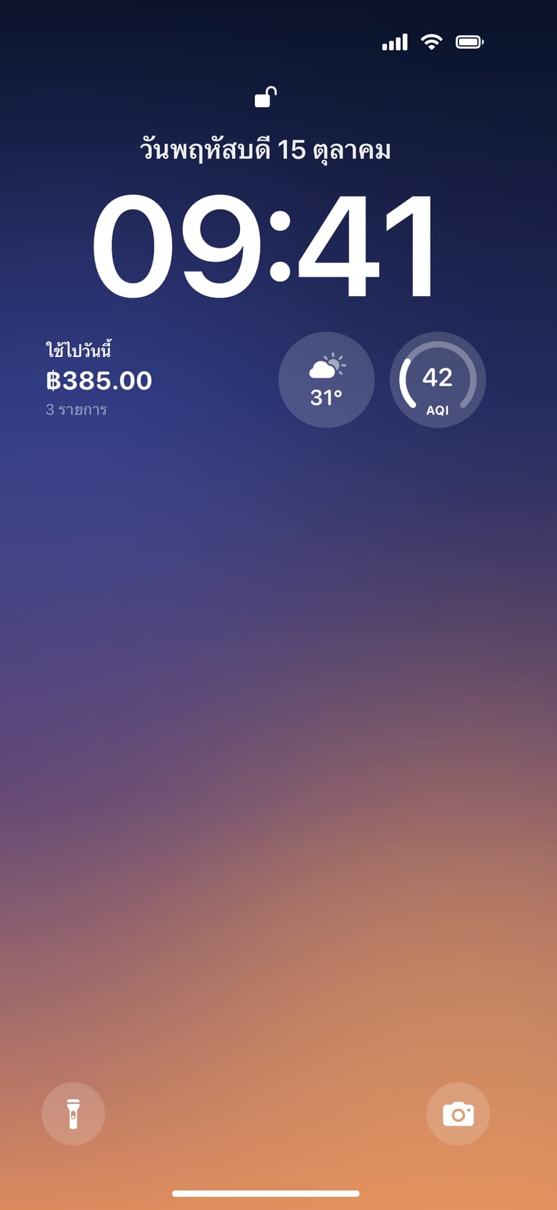 JaiJod widget on the Lock Screen, under the clock: 385 baht spent today across 3 entries